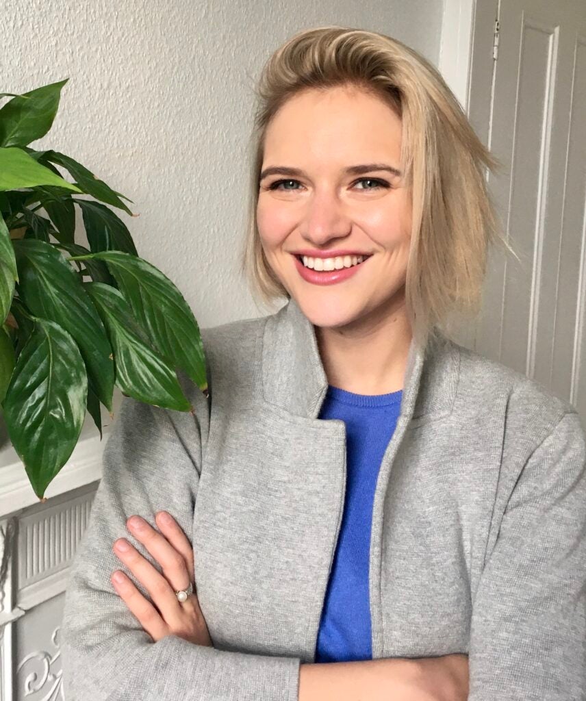 Dr. Christine Slobogin, a white woman with chin-length blond hair, smiling and wearing a gray blazer over a blue shirt.