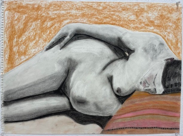 Charcoal and conte crayon drawing on a reclining nude, hand on hip and head resting on a colorful pillow. 