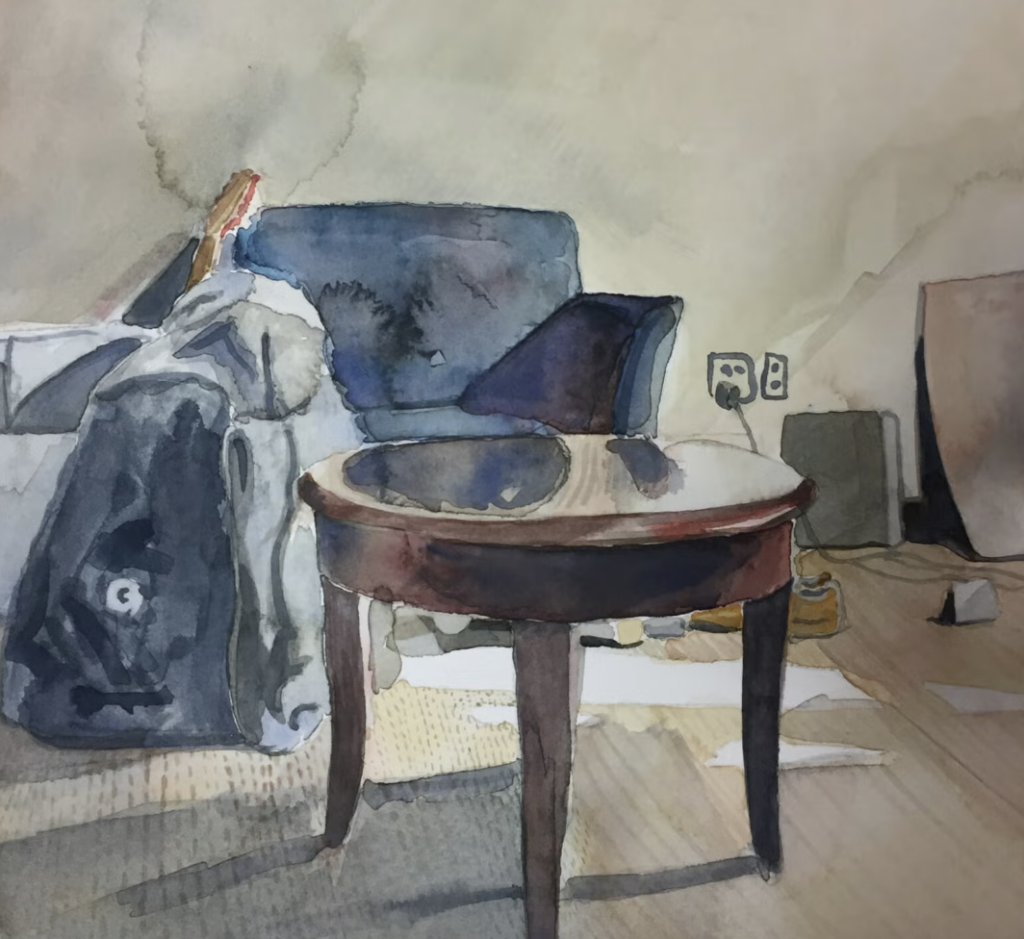 A watercolor of a coffee table with a blue armchair behind it and a backpack sitting on the floor.