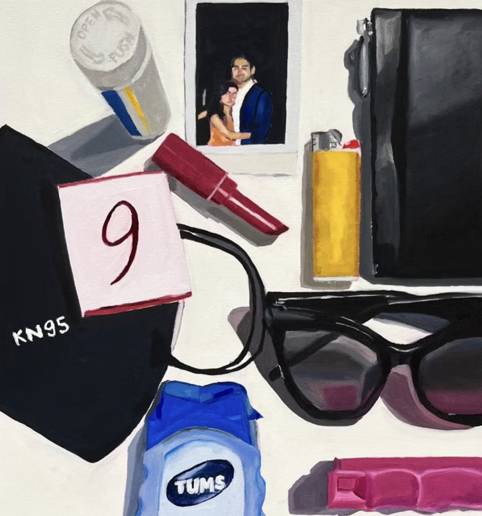 A still life including lipstick, a lighter, sunglasses, and other items, laid out on a table. 