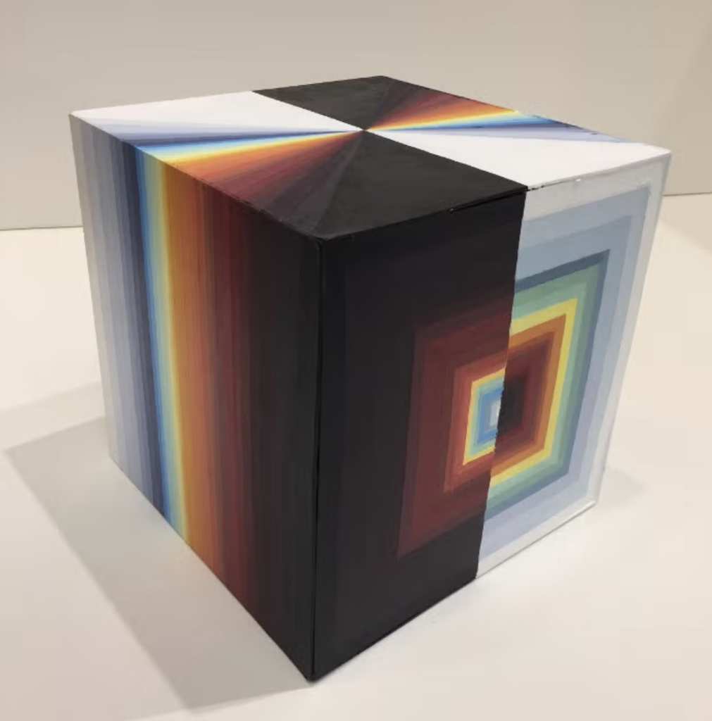 A cube painted in rainbow